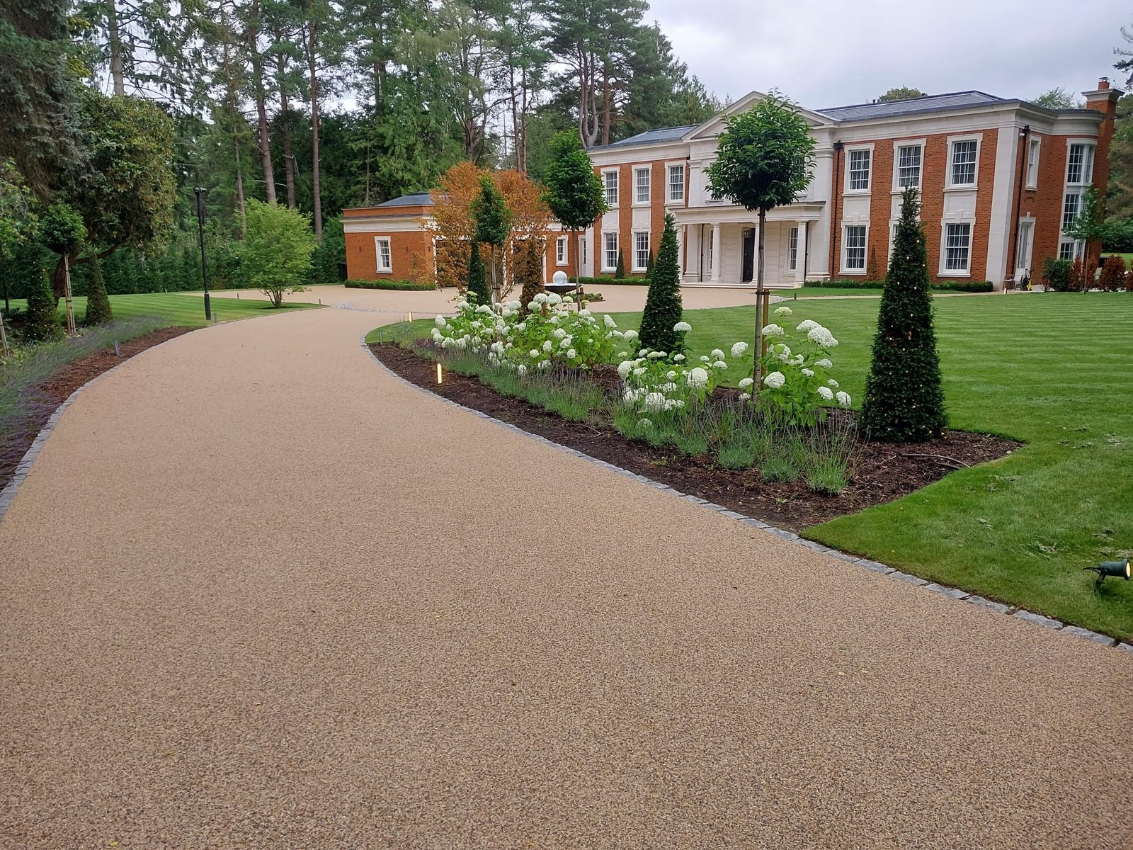 Resin driveway framing a Hampshire country house